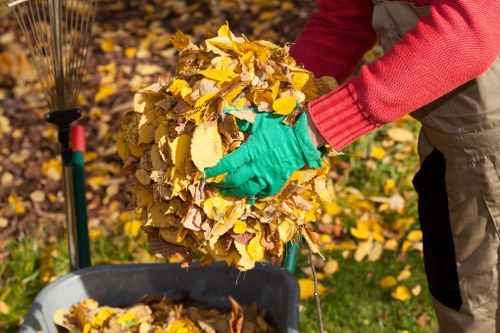 Residents arranging furniture for disposal in Plumstead